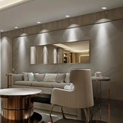 Accesorio de luz empotrada GU10 elegante en una cocina moderna, mejorando la decoración contemporánea con un acabado en blanco y negro pulido. 143-03407