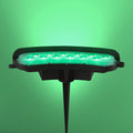 Foco LED de 12W ideal para exteriores, perfecto para jardines con estilo contemporáneo, ofreciendo luz cálida o verde.