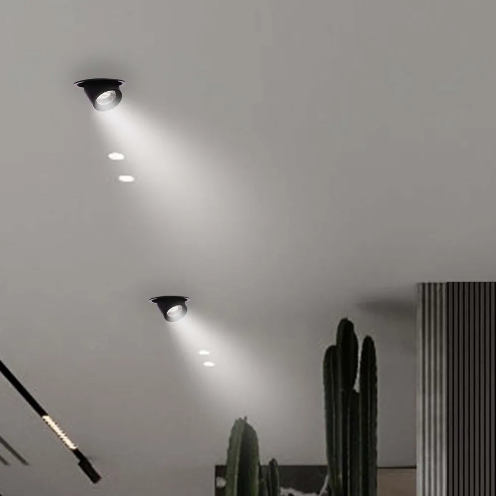 La moderna luz empotrada LED ajustable mejora una sala de estar elegante con decoración minimalista, proporcionando una iluminación abundante y un acabado elegante.143-03410
