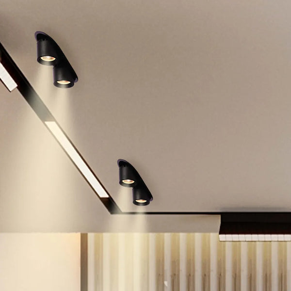 Downlight LED moderno en una sala de estar elegante, que se integra perfectamente con la decoración contemporánea y proporciona iluminación ajustable para un mejor ambiente.143-03412