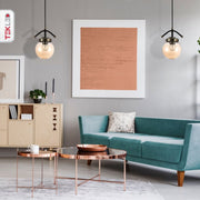 Amber Glass Globe Black And Antique Brass Pendant Light E27 in indoor setting living room waiting room