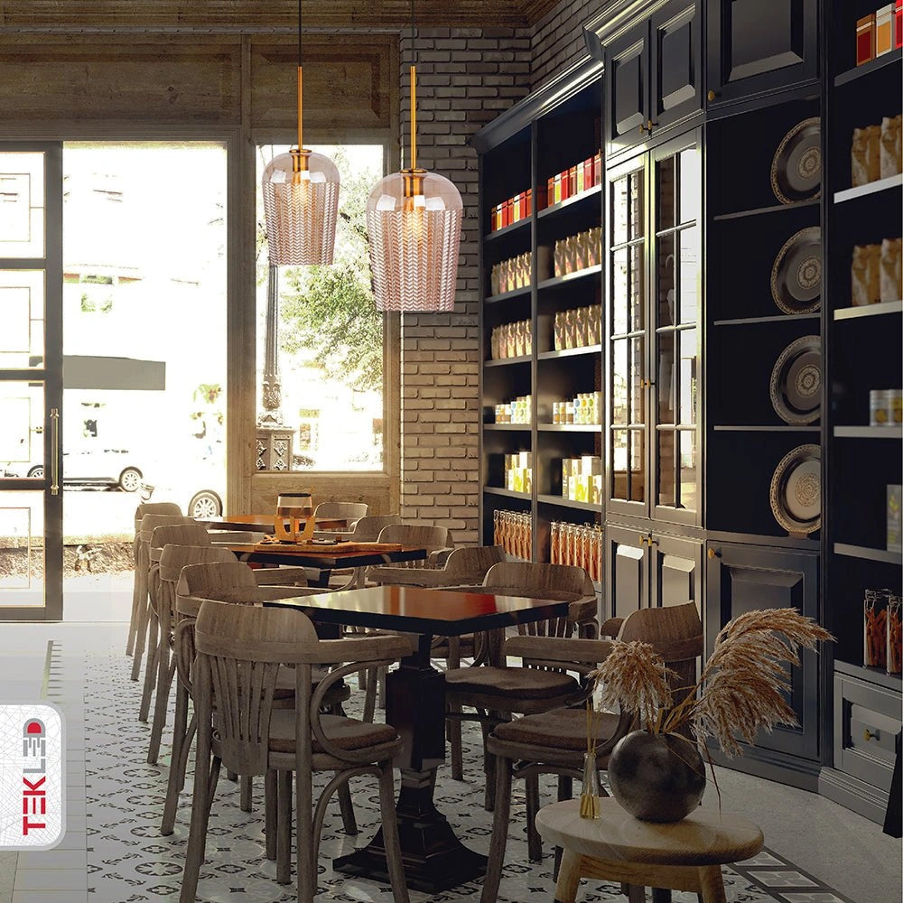 Amber glass schoolhouse pendant light with e27 fitting in indoor setting caf√© table tops