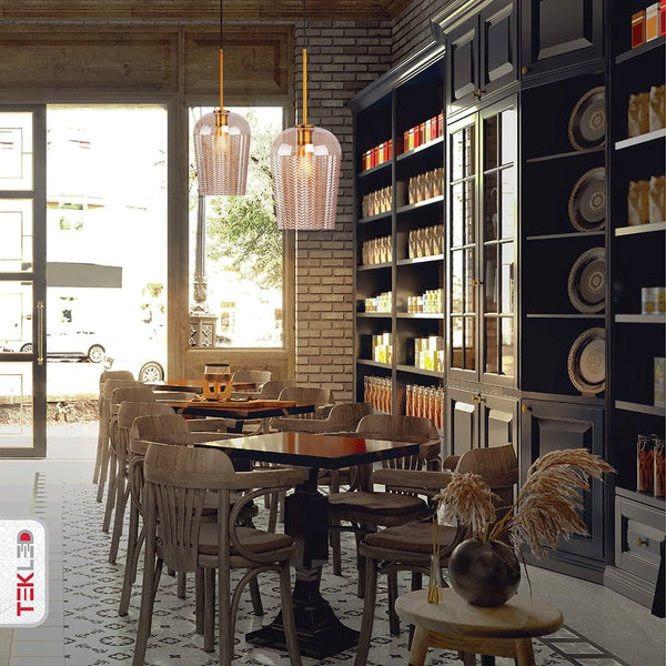 Amber glass schoolhouse pendant light with e27 fitting in indoor setting caf√© table tops