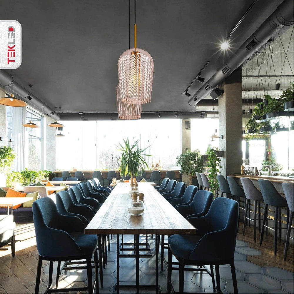 Amber glass schoolhouse pendant light with e27 fitting in indoor setting caf√© restaurant