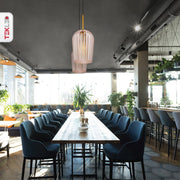 Amber glass schoolhouse pendant light with e27 fitting in indoor setting caf√© restaurant