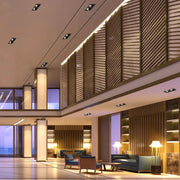 Una elegante luminaria empotrable GU10 iluminando una sala de estar moderna con decoración minimalista, realzando la atmósfera contemporánea del espacio.143-03446